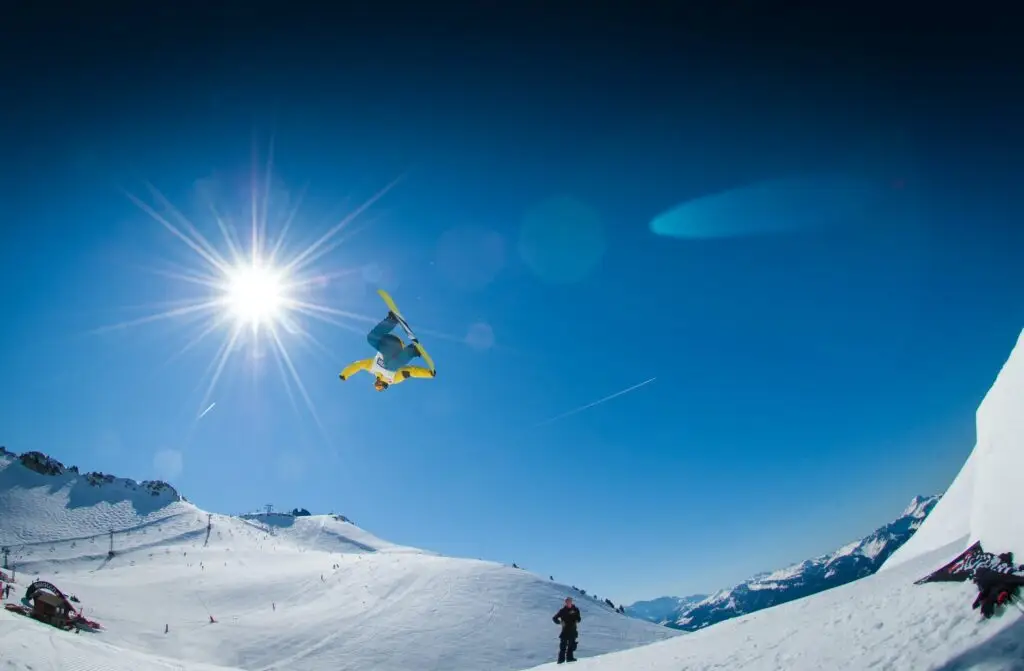 man performing snowboard stunts