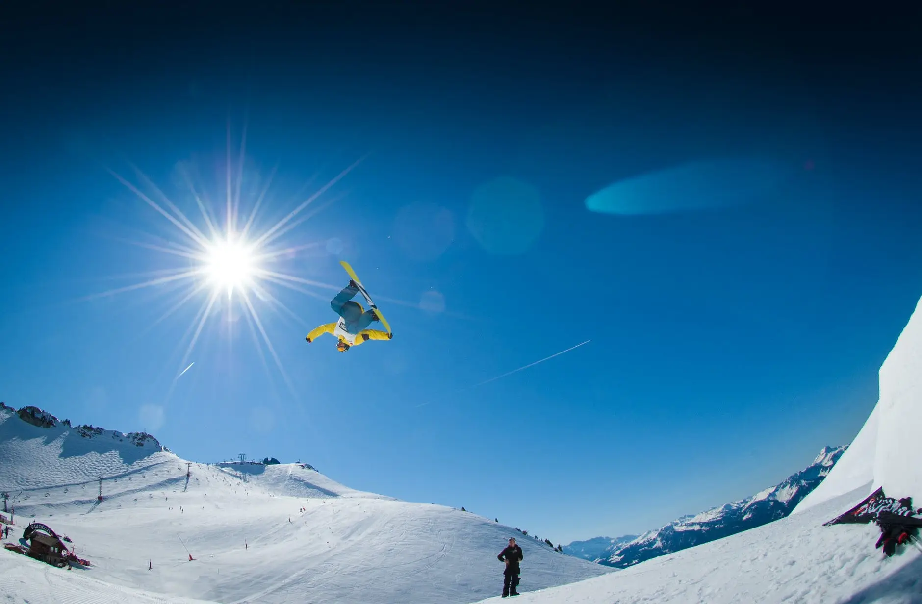 man performing snowboard stunts